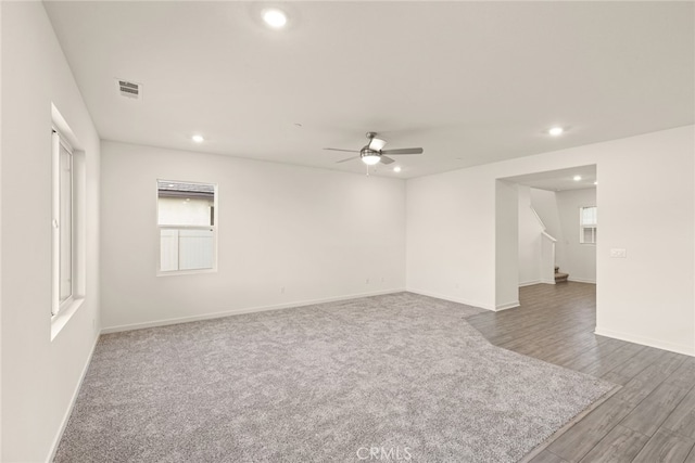 empty room with hardwood / wood-style flooring and ceiling fan