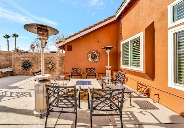 view of patio featuring a fire pit