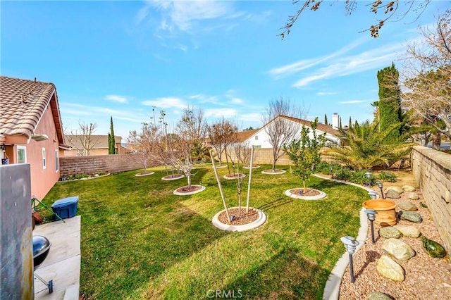 view of yard with a fire pit