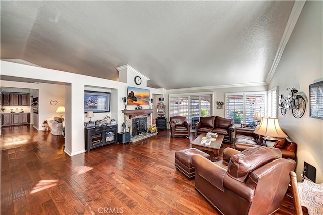 living room featuring hardwood / wood-style flooring, a textured ceiling, crown molding, and vaulted ceiling