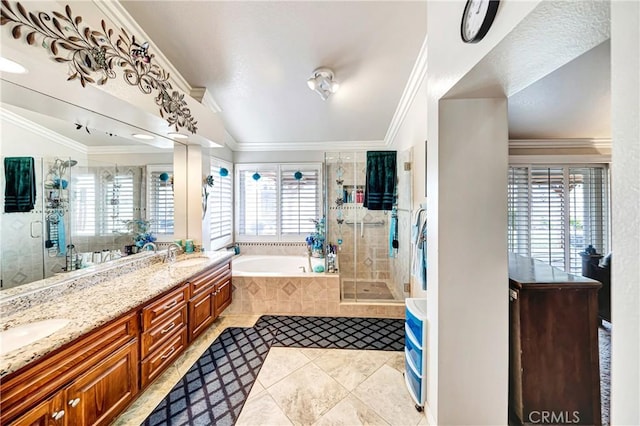 bathroom with lofted ceiling, vanity, tile patterned flooring, crown molding, and shower with separate bathtub