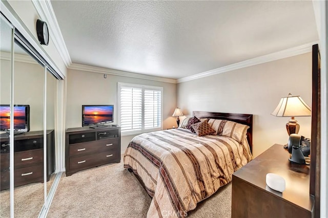 bedroom with light carpet, a closet, ornamental molding, and a textured ceiling