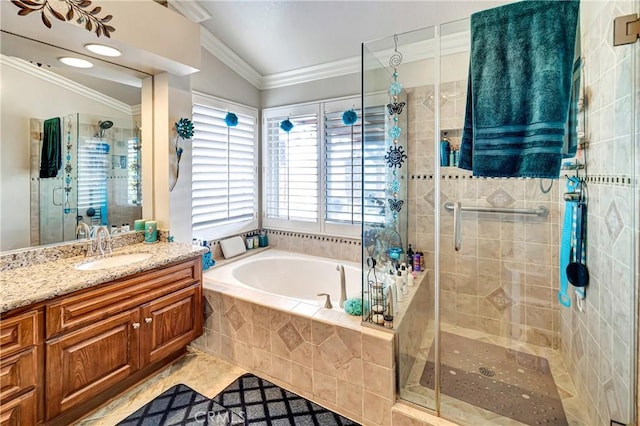 bathroom with vaulted ceiling, independent shower and bath, tile patterned flooring, and vanity