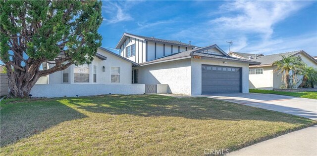 view of front of home with a garage and a front yard