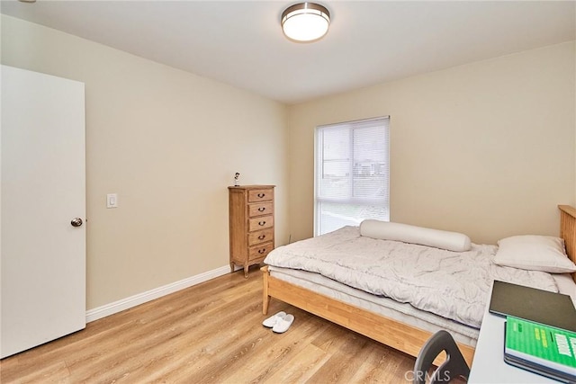 bedroom with light wood-type flooring