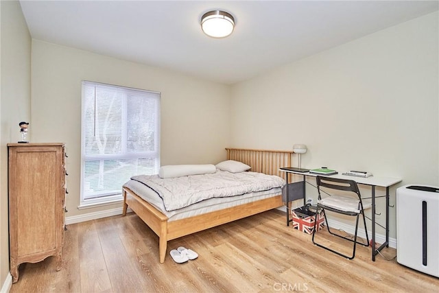 bedroom with wood-type flooring