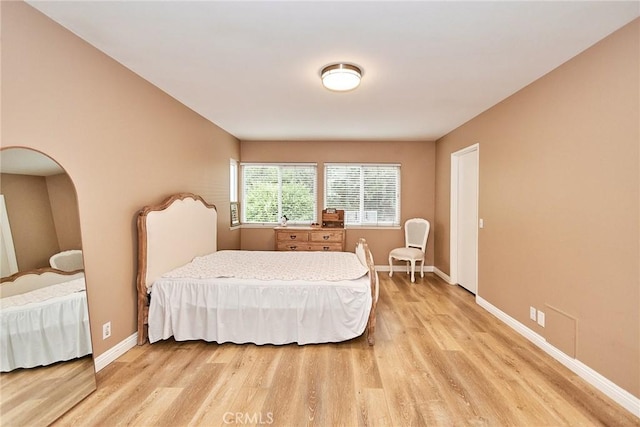 bedroom with light hardwood / wood-style flooring