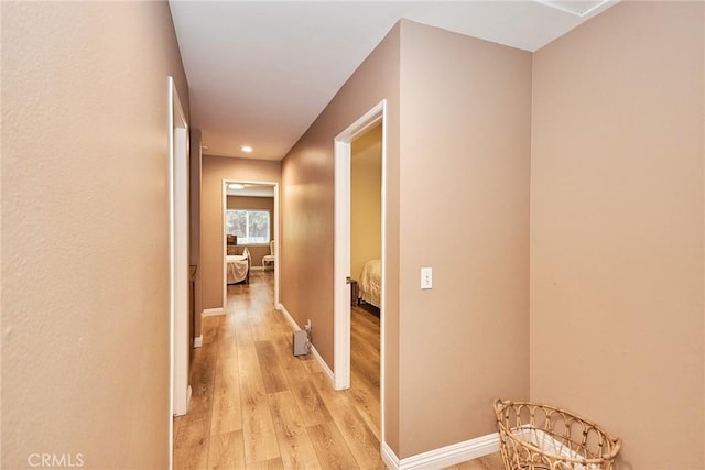 corridor featuring light hardwood / wood-style floors