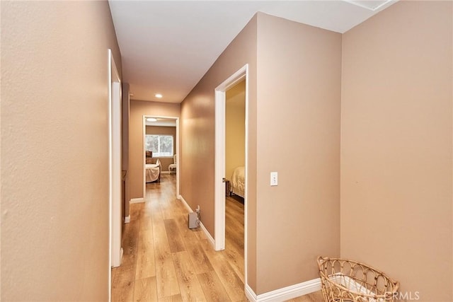 hallway with light wood-type flooring