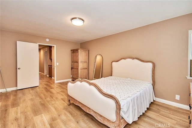 bedroom with light hardwood / wood-style floors