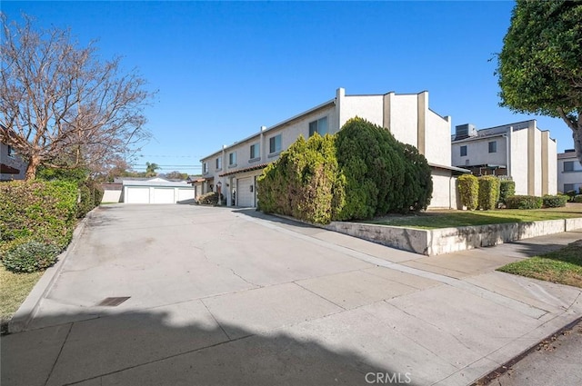 view of side of property with a garage