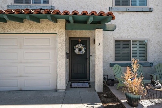 doorway to property featuring a garage