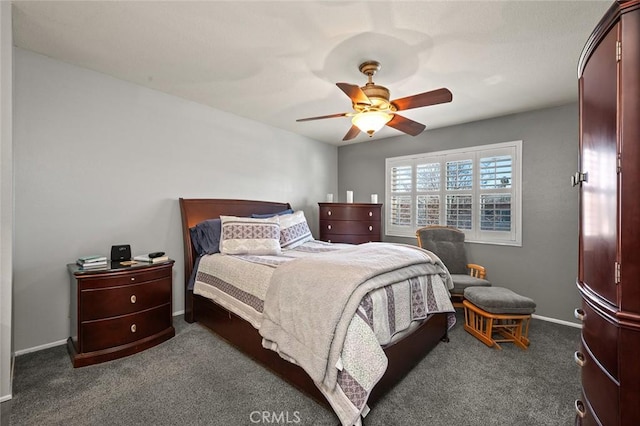 bedroom featuring ceiling fan and dark carpet