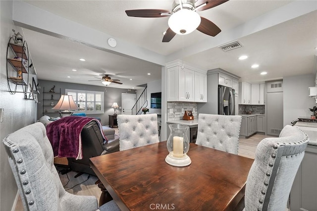 dining area featuring ceiling fan and light hardwood / wood-style floors