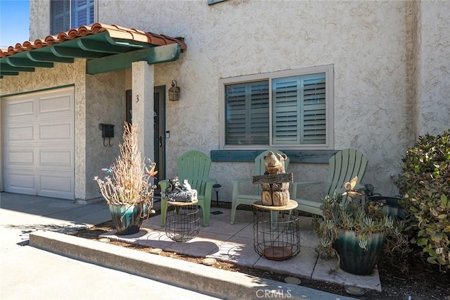 property entrance featuring a garage