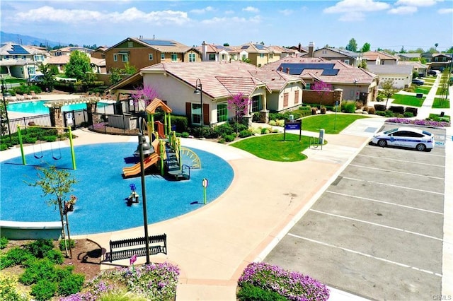 view of pool featuring a playground