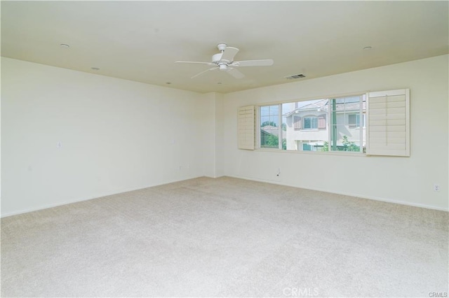 carpeted empty room with ceiling fan