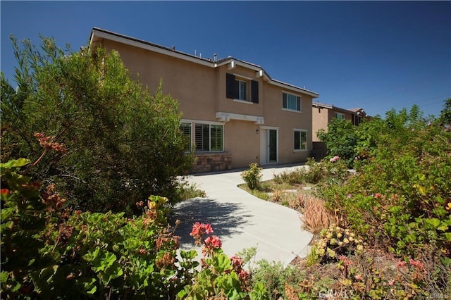 back of property featuring a patio