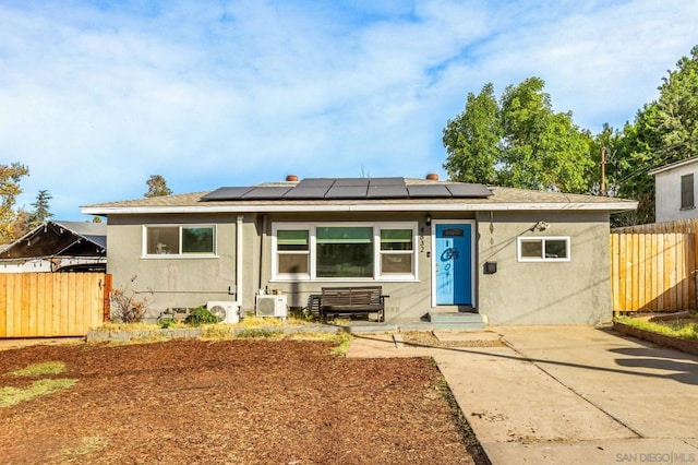 view of front of property with solar panels