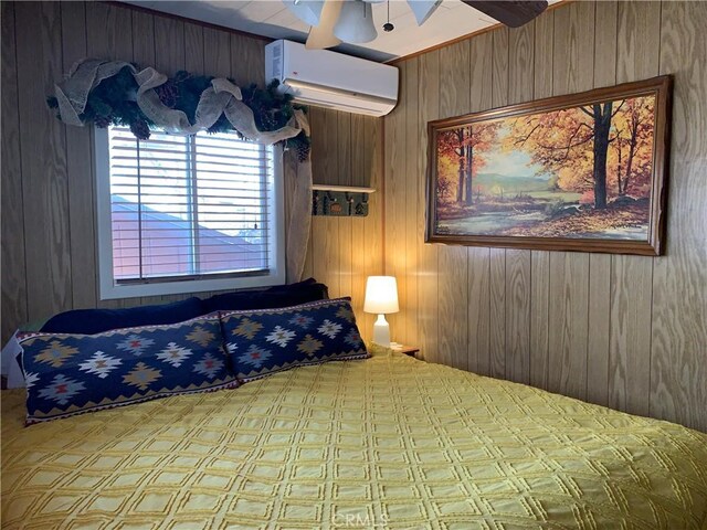 bedroom with an AC wall unit, ceiling fan, and wooden walls