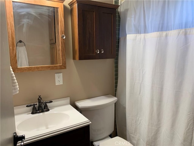 bathroom with toilet and vanity