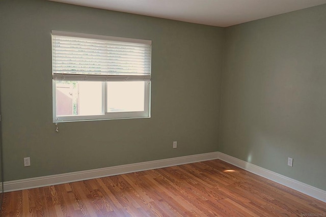 spare room featuring hardwood / wood-style floors