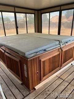 deck featuring a hot tub