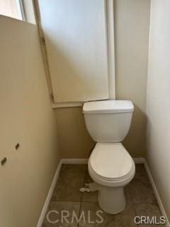 bathroom featuring tile patterned floors and toilet