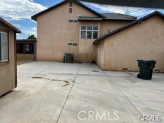 back of house with a patio