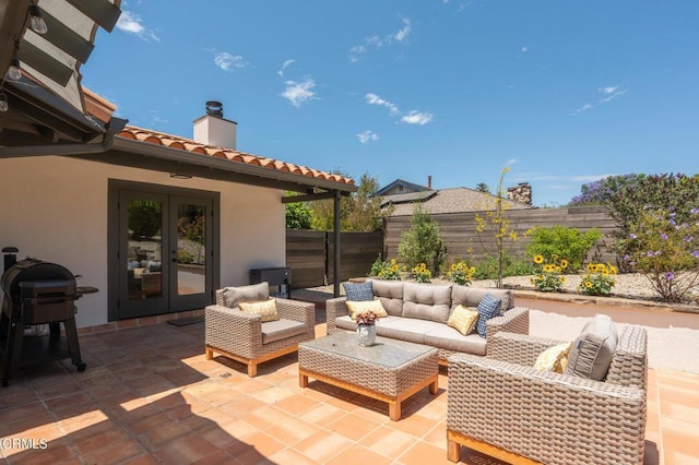 view of patio featuring a grill, outdoor lounge area, and french doors