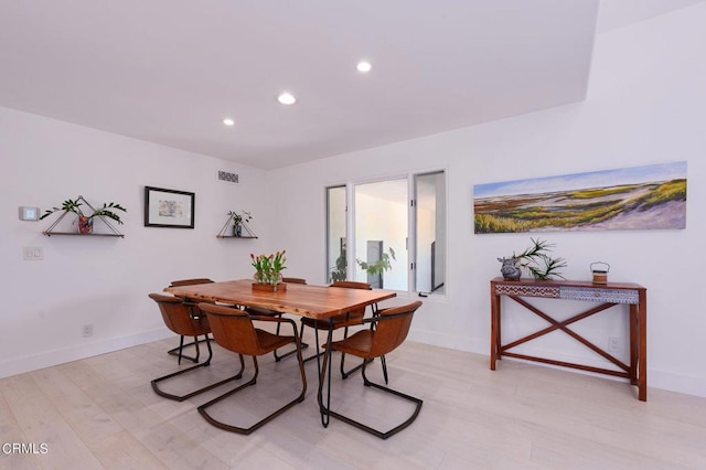 dining room with light wood-type flooring