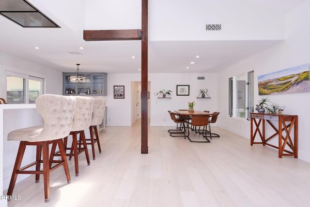 dining space with light hardwood / wood-style floors