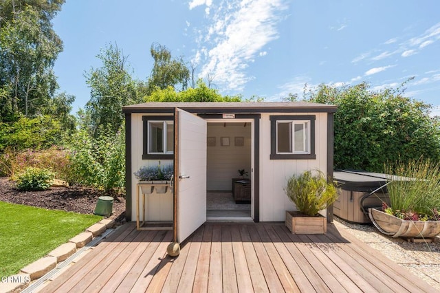 view of outbuilding featuring a hot tub