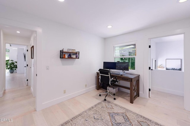 home office with light wood-type flooring