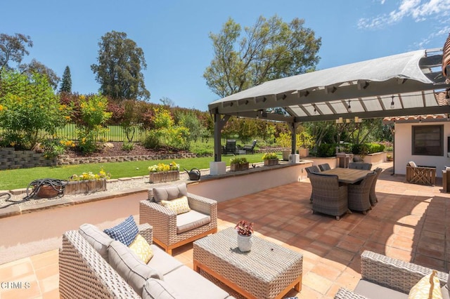 view of patio / terrace with a gazebo and an outdoor living space with a fireplace