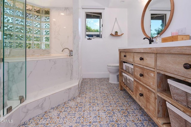 full bathroom featuring toilet, vanity, and shower with separate bathtub