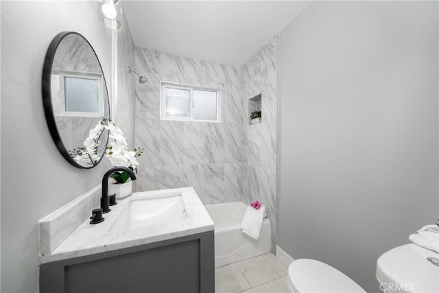 full bathroom featuring tiled shower / bath combo, tile patterned floors, vanity, a healthy amount of sunlight, and toilet