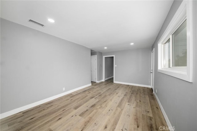 unfurnished room featuring light hardwood / wood-style flooring