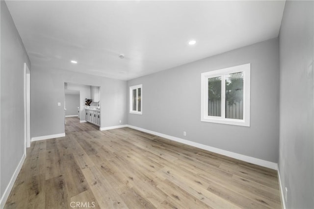 unfurnished living room featuring light hardwood / wood-style flooring