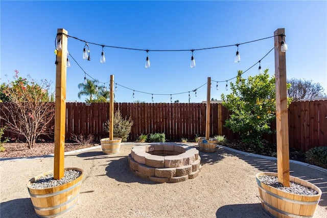 view of patio / terrace with an outdoor fire pit