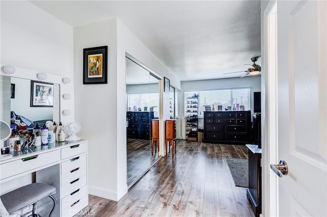 interior space featuring a textured ceiling, a wealth of natural light, and hardwood / wood-style floors