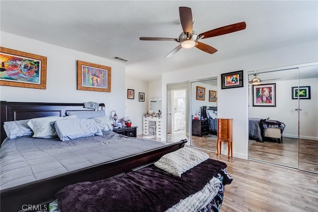 bedroom with ceiling fan, a closet, and light hardwood / wood-style floors