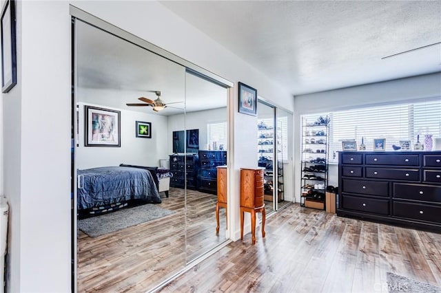 bedroom featuring ceiling fan and wood-type flooring