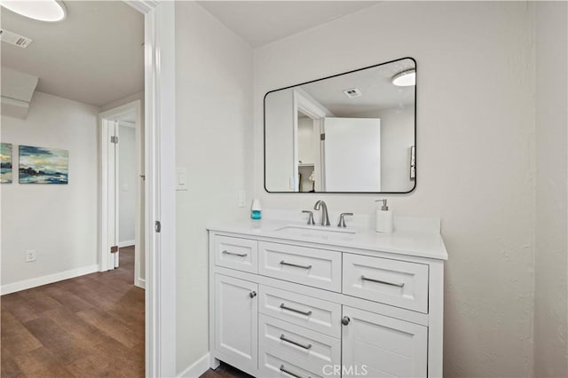 bathroom featuring hardwood / wood-style flooring and vanity