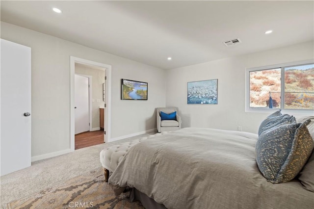 bedroom featuring visible vents, connected bathroom, baseboards, carpet floors, and recessed lighting