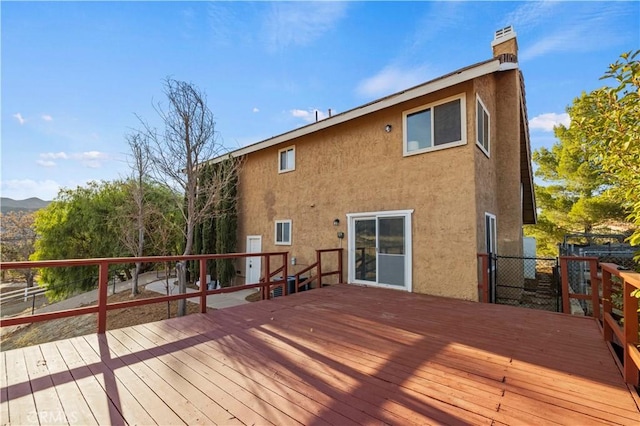 wooden deck with a mountain view