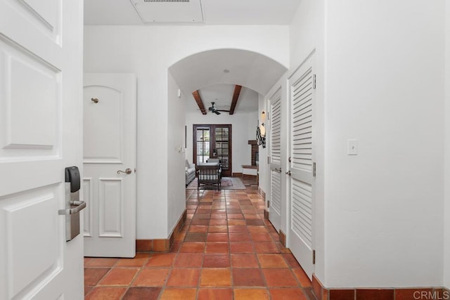 hall featuring tile patterned flooring