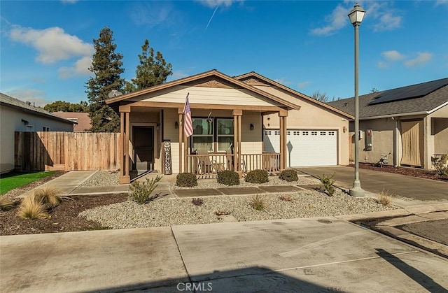 view of front of home featuring a garage and covered porch