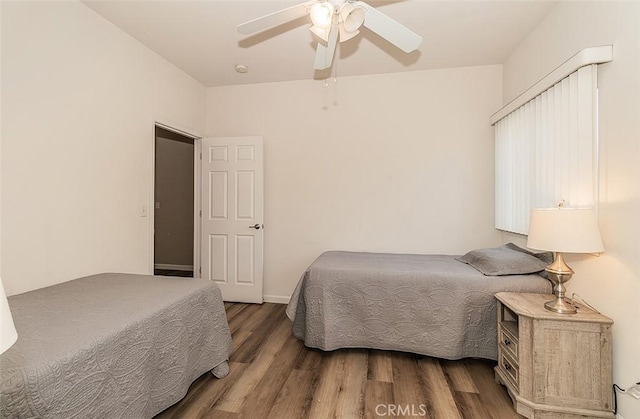 bedroom featuring hardwood / wood-style flooring and ceiling fan