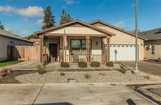 view of front of property featuring a garage and a porch